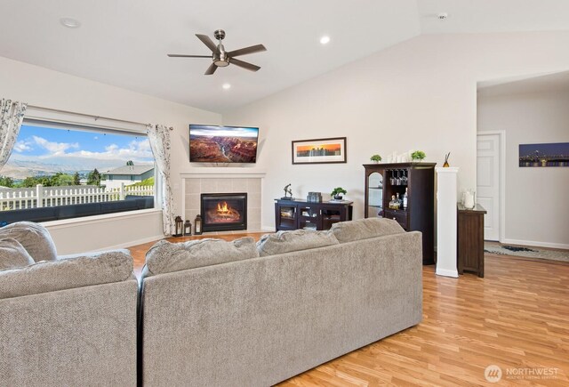 2615 N Baker Ave, East Wenatchee, WA 98802 - living area featuring a ceiling fan, vaulted ceiling, light wood-style floors, a tiled fireplace, and recessed lighting