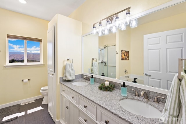 2615 N Baker Ave, East Wenatchee, WA 98802 - full bath featuring a stall shower, double vanity, recessed lighting, and a bath