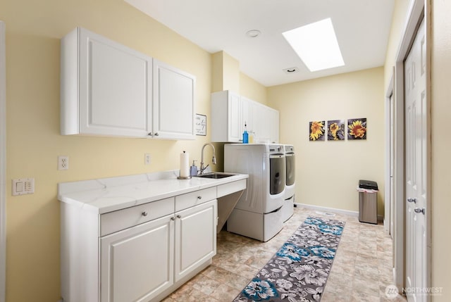 2615 N Baker Ave, East Wenatchee, WA 98802 - laundry area with cabinet space, a skylight, and washing machine and clothes dryer
