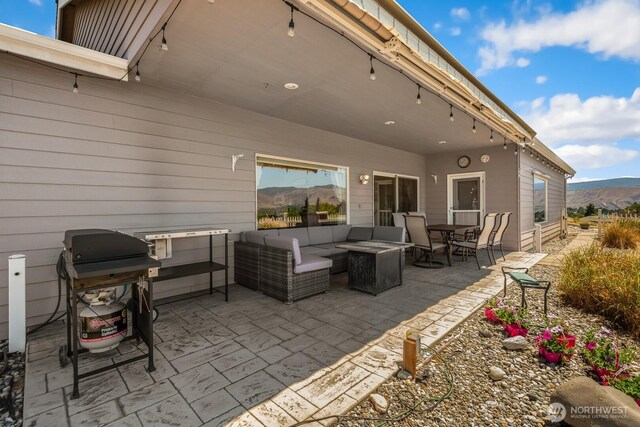2615 N Baker Ave, East Wenatchee, WA 98802 - view of patio with grilling area, a mountain view, and outdoor lounge area