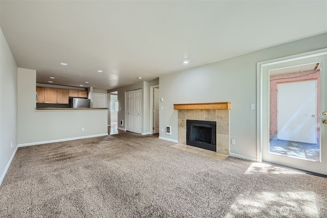 26339 116th Ave SE Unit I202, Kent, WA 98030 - unfurnished living room featuring carpet, recessed lighting, and a tile fireplace