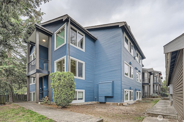 26339 116th Ave SE Unit I202, Kent, WA 98030 - view of side of home featuring a balcony