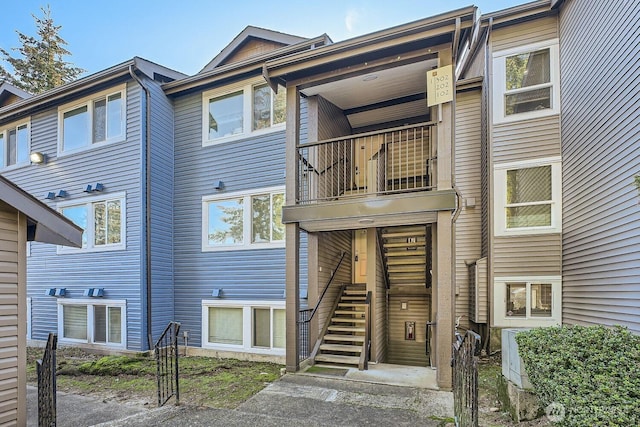 26339 116th Ave SE Unit I202, Kent, WA 98030 - back of house featuring a balcony and stairs