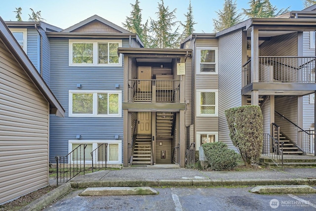 26339 116th Ave SE Unit I202, Kent, WA 98030 - view of property featuring stairs and uncovered parking