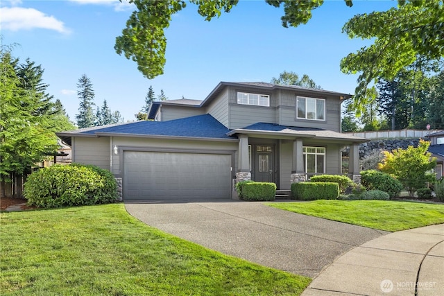 7526 148th Pl SE, Snohomish, WA 98296 - view of front of property featuring a garage, stone siding, concrete driveway, a front yard, and a porch