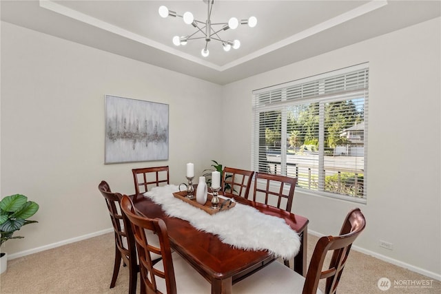 7526 148th Pl SE, Snohomish, WA 98296 - dining room featuring light colored carpet, a raised ceiling, and a chandelier
