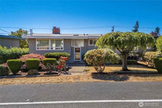 22223 10th Ave S, Des Moines, WA 98198 - bi-level home featuring a chimney