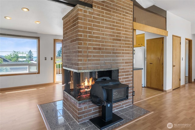 22223 10th Ave S, Des Moines, WA 98198 - living room with light wood-style floors, a fireplace, and recessed lighting