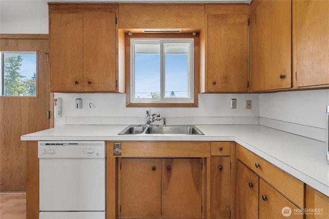 22223 10th Ave S, Des Moines, WA 98198 - kitchen with white dishwasher, light countertops, and brown cabinets