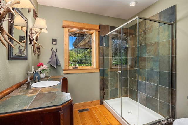 639 A Twisp River Rd, Twisp, WA 98856 - bathroom featuring a shower stall, hardwood / wood-style flooring, and vanity