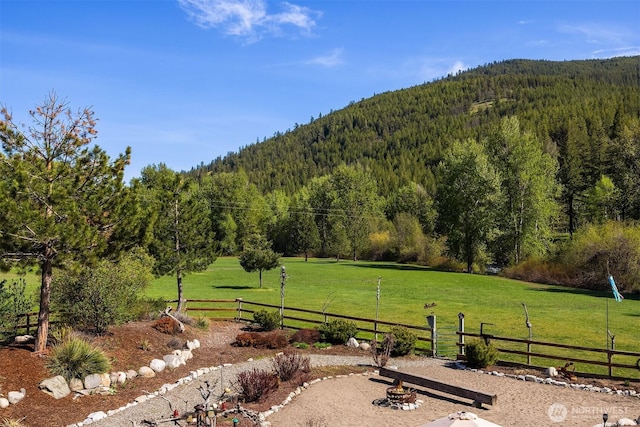 639 A Twisp River Rd, Twisp, WA 98856 - view of yard with a wooded view, a mountain view, and a view of rural / pastoral area
