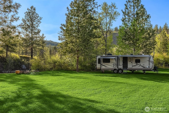 639 A Twisp River Rd, Twisp, WA 98856 - view of grassy yard with a wooded view