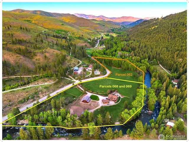 639 A Twisp River Rd, Twisp, WA 98856 - aerial view of property and surrounding area with a mountainous background and property boundaries highlighted