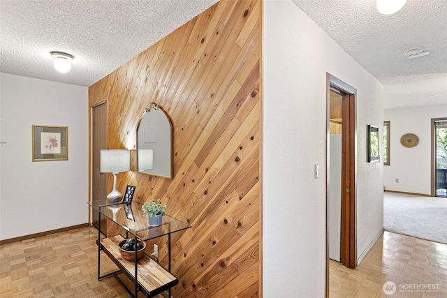 12840 SE 40th Ct Unit A4, Bellevue, WA 98006 - hallway featuring wooden walls and a textured ceiling