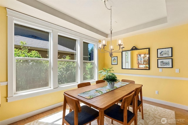 1422 Brighton Way SE, Olympia, WA 98501 - dining area featuring a chandelier, wood finished floors, and a tray ceiling