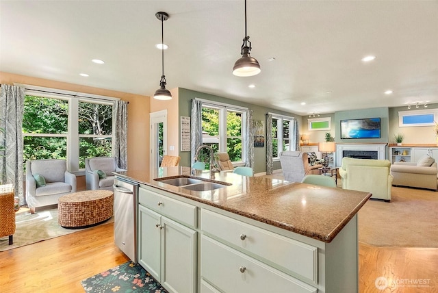 1422 Brighton Way SE, Olympia, WA 98501 - kitchen with open floor plan, stainless steel dishwasher, a kitchen island with sink, recessed lighting, and light wood-style flooring