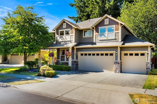 1422 Brighton Way SE, Olympia, WA 98501 - craftsman house featuring driveway, stone siding, and an attached garage