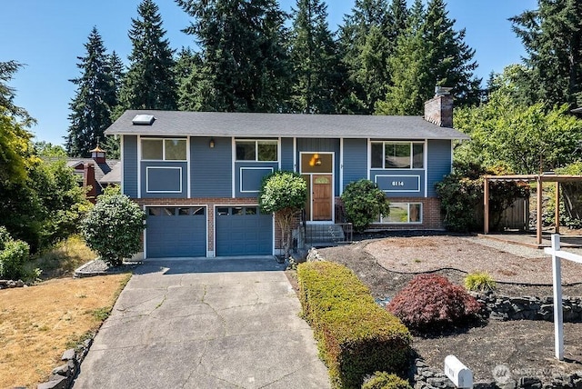 6114 47th Street Ct W, University Place, WA 98466 - raised ranch with a chimney, driveway, brick siding, a garage, and entry steps