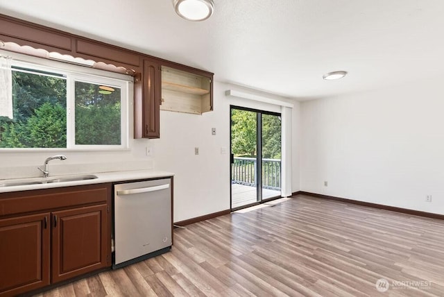 6114 47th Street Ct W, University Place, WA 98466 - kitchen featuring dishwasher, light countertops, and light wood-style flooring
