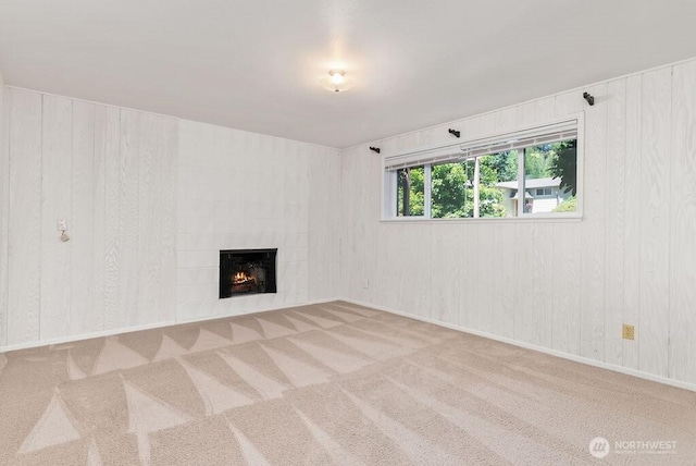 6114 47th Street Ct W, University Place, WA 98466 - unfurnished living room with carpet floors, a tiled fireplace, and wooden walls