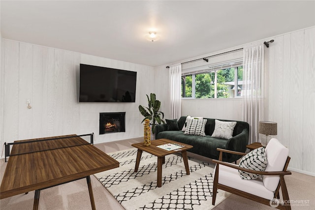 6114 47th Street Ct W, University Place, WA 98466 - living room featuring a lit fireplace, wood walls, and light carpet