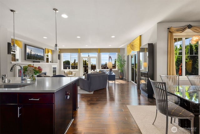 6511 108th Ave NE Unit 3, Kirkland, WA 98033 - kitchen featuring dark wood-style floors, open floor plan, light countertops, recessed lighting, and modern cabinets