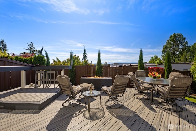 6511 108th Ave NE Unit 3, Kirkland, WA 98033 - wooden deck with outdoor dining space