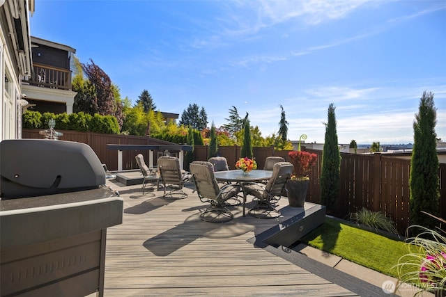 6511 108th Ave NE Unit 3, Kirkland, WA 98033 - deck featuring outdoor dining area, a fenced backyard, and a grill