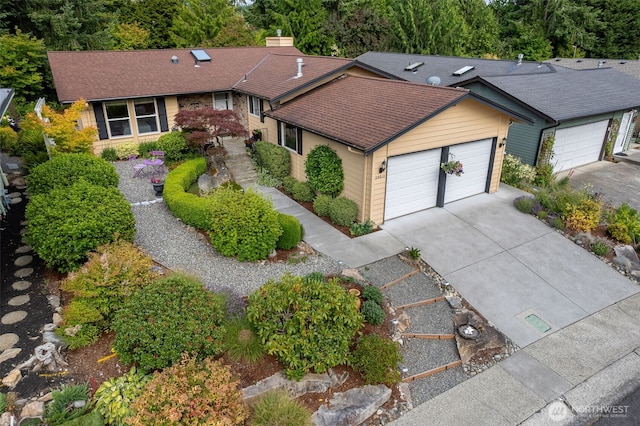 24812 12th Ave S, Des Moines, WA 98198 - single story home featuring concrete driveway, a garage, and roof with shingles