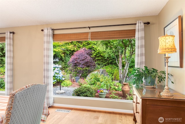 24812 12th Ave S, Des Moines, WA 98198 - living area featuring wood finished floors and healthy amount of natural light