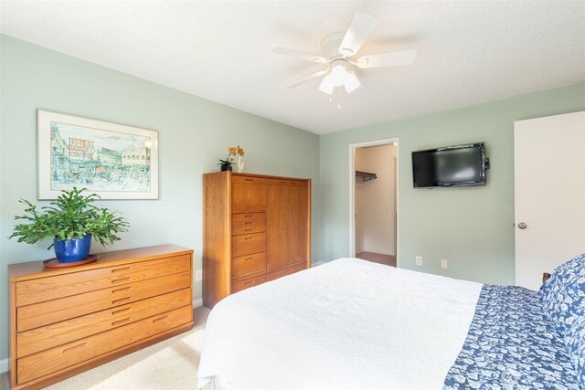 24812 12th Ave S, Des Moines, WA 98198 - bedroom featuring a walk in closet and a ceiling fan