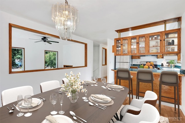34716 4th Pl S, Federal Way, WA 98003 - dining room with wood finished floors, a ceiling fan, and a chandelier