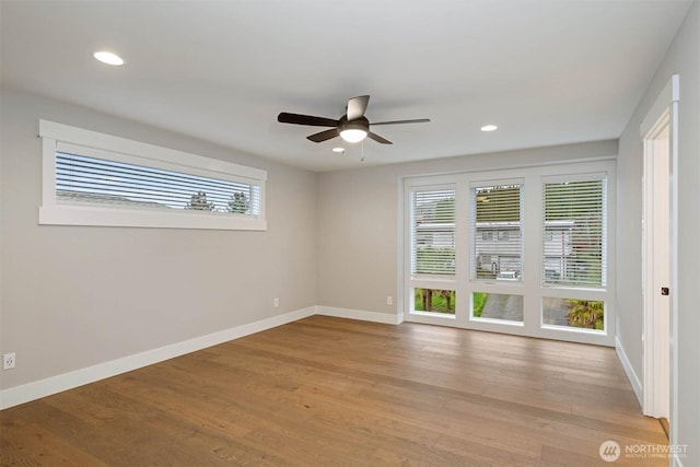 7560 S 130th Pl, Seattle, WA 98178 - spare room featuring wood finished floors, a ceiling fan, and recessed lighting