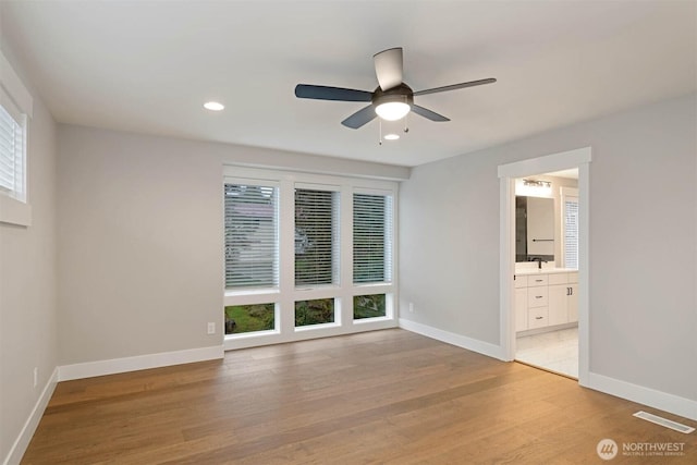 7560 S 130th Pl, Seattle, WA 98178 - unfurnished room featuring light wood-type flooring, ceiling fan, and recessed lighting