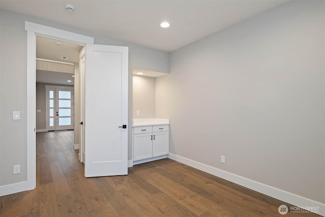 7560 S 130th Pl, Seattle, WA 98178 - unfurnished bedroom featuring dark wood finished floors, french doors, and recessed lighting