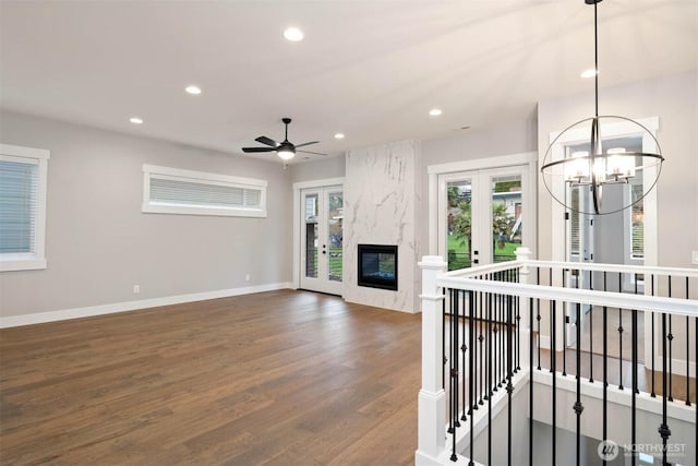 7560 S 130th Pl, Seattle, WA 98178 - unfurnished living room with a chandelier, wood finished floors, recessed lighting, healthy amount of natural light, and ceiling fan