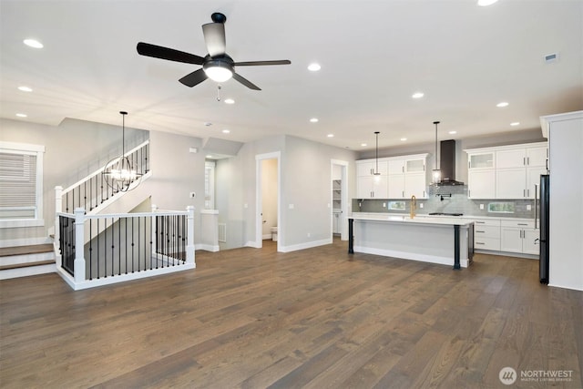 7560 S 130th Pl, Seattle, WA 98178 - kitchen with wall chimney exhaust hood, freestanding refrigerator, dark wood-style floors, light countertops, and recessed lighting