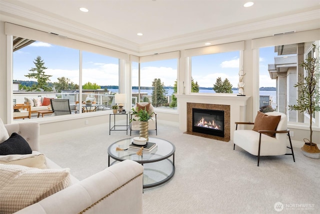 6424 Lake Washington Blvd NE Unit 34, Kirkland, WA 98033 - carpeted living area featuring ornamental molding, a fireplace with flush hearth, recessed lighting, and a water view