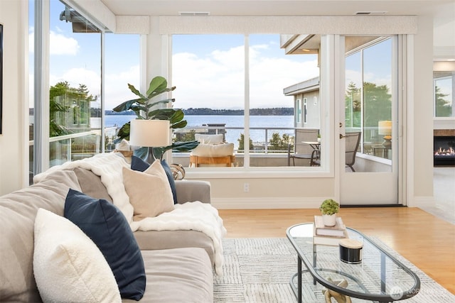 6424 Lake Washington Blvd NE Unit 34, Kirkland, WA 98033 - living room with wood finished floors and a water view