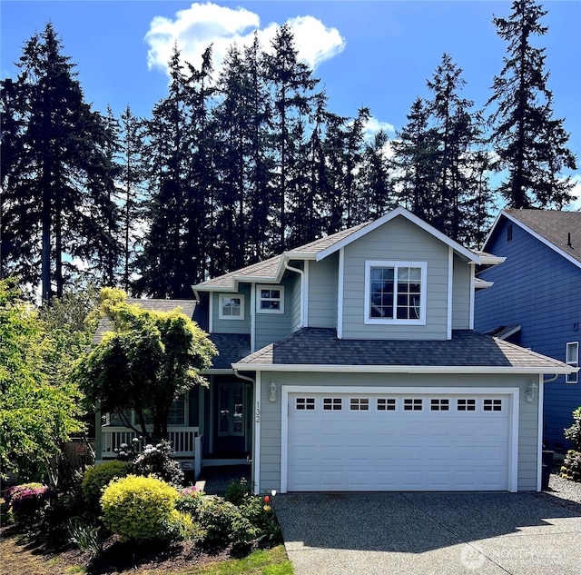 132 170th Pl SE, Bothell, WA 98012 - view of front facade featuring asphalt driveway, an attached garage, roof with shingles, and covered porch