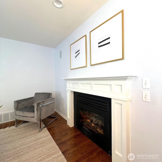 132 170th Pl SE, Bothell, WA 98012 - living area with a glass covered fireplace and dark wood-type flooring