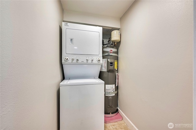 8021 234th St SW Unit 211, Edmonds, WA 98026 - laundry room featuring stacked washer / drying machine and strapped water heater