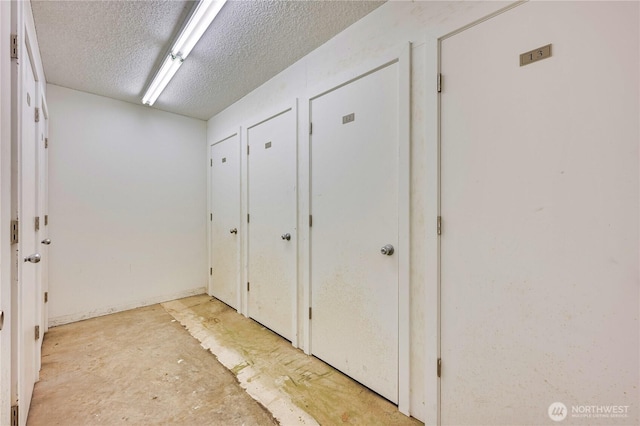 8021 234th St SW Unit 211, Edmonds, WA 98026 - hallway with a textured ceiling
