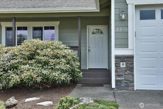 4880 Harbor Hills Dr, Freeland, WA 98249 - entrance to property featuring a shingled roof and stone siding
