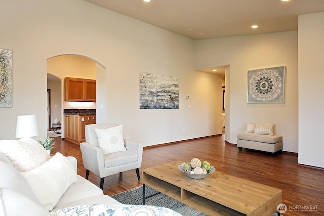 4880 Harbor Hills Dr, Freeland, WA 98249 - living area with arched walkways, recessed lighting, and dark wood-style flooring