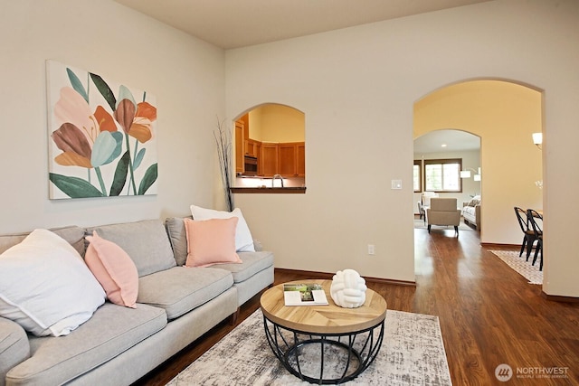 4880 Harbor Hills Dr, Freeland, WA 98249 - living room featuring arched walkways and dark wood-style floors