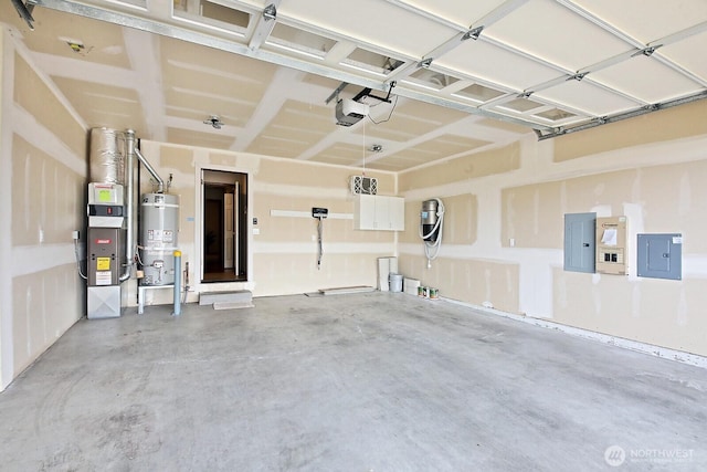 4880 Harbor Hills Dr, Freeland, WA 98249 - garage with secured water heater, electric panel, and a garage door opener