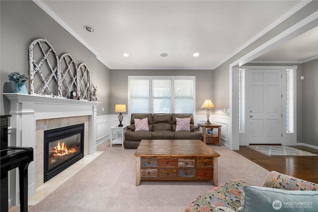 5625 Elizabeth Ave SE, Auburn, WA 98092 - living room with a premium fireplace, a wainscoted wall, ornamental molding, and carpet flooring