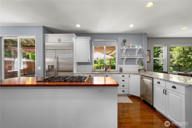 5625 Elizabeth Ave SE, Auburn, WA 98092 - kitchen featuring appliances with stainless steel finishes, butcher block counters, healthy amount of natural light, white cabinets, and recessed lighting