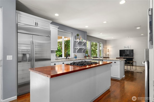 5625 Elizabeth Ave SE, Auburn, WA 98092 - kitchen with wood counters, stainless steel built in fridge, gas cooktop, a center island, and white cabinets